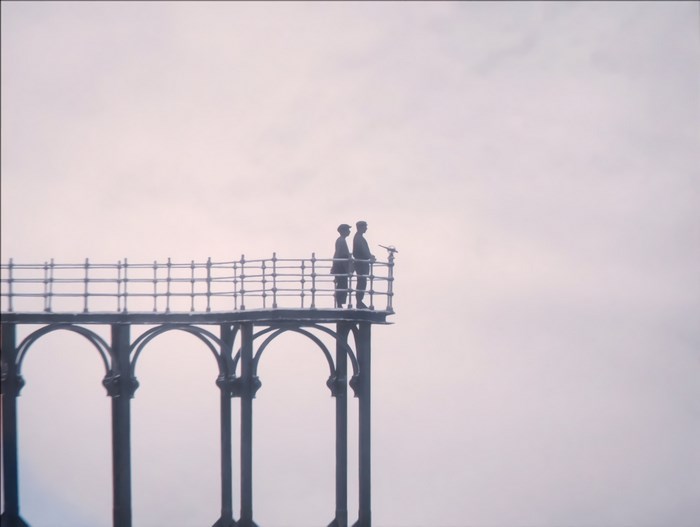 Two figures on a pier from The Grand Budapest Hotel