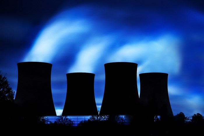 Cooling towers at a power plant at night