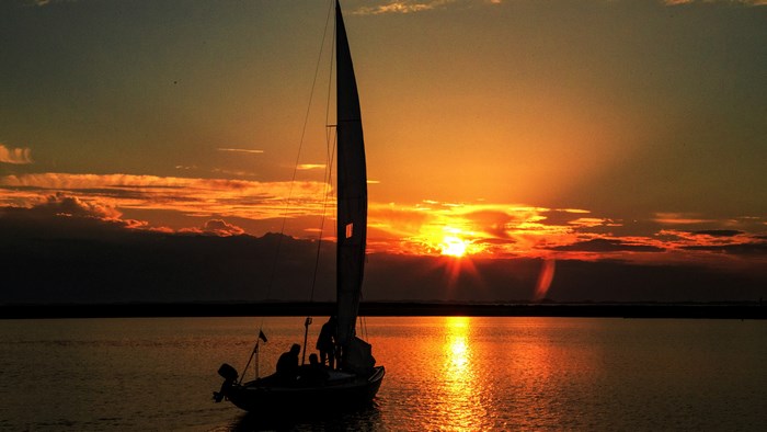 Sailboat on the water at sunset