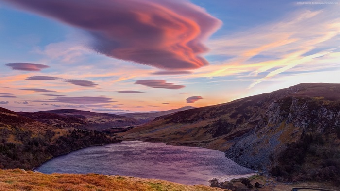 Lenticular Clouds Over a Lake at Sunset