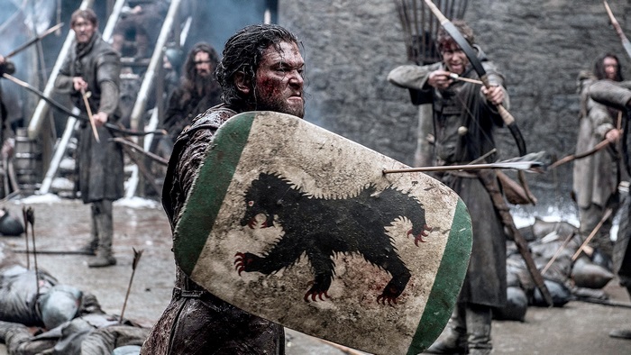 Jon Snow in battle with shield and arrows