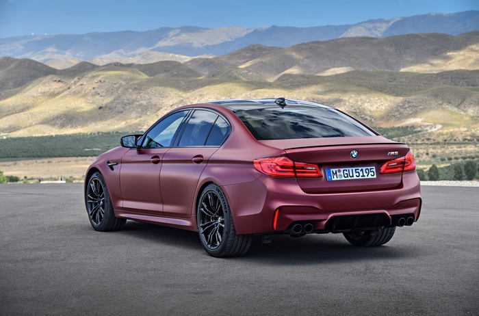 BMW M5 F90 sedan in matte red