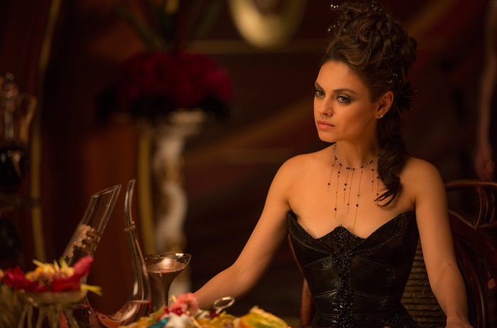 Mila Kunis in a black corset