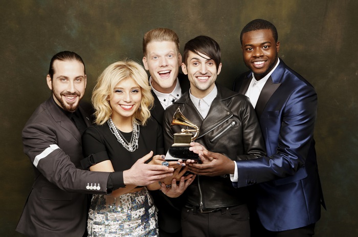 Pentatonix holding a Grammy award