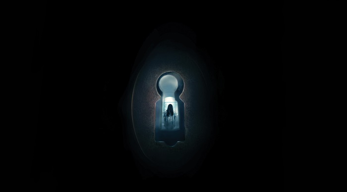 Woman seen through a keyhole
