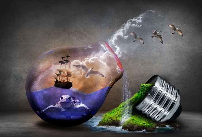 Surreal lightbulb with sea turtle, ship, and island
