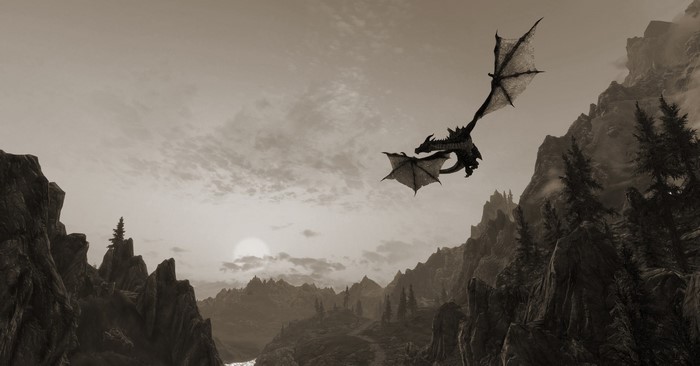 Dragon flying over mountains in The Elder Scrolls V Skyrim