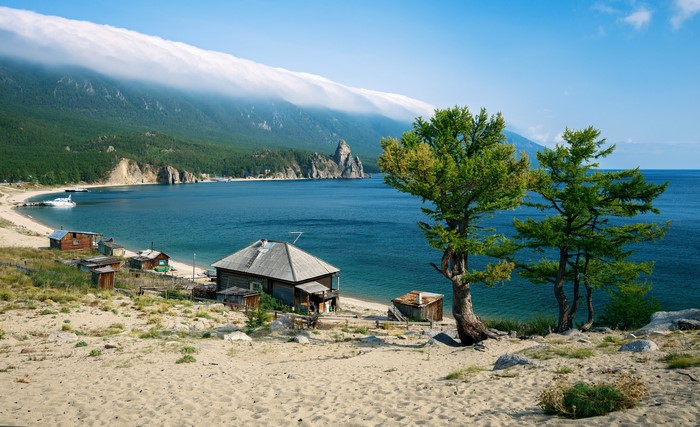 Lake Baikal Shore with Rustic Houses and Mountain View