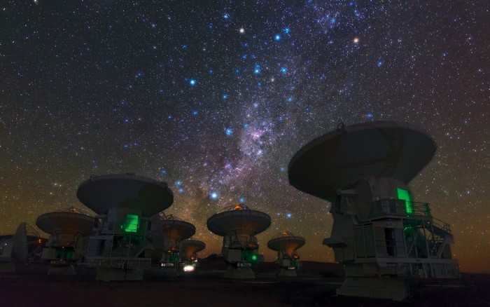Radio telescopes under the Milky Way in Atacama Desert