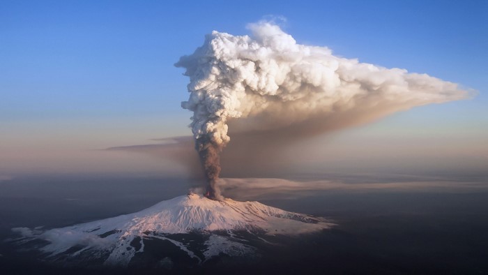 Mount Etna volcano eruption with snow in Sicily, Italy