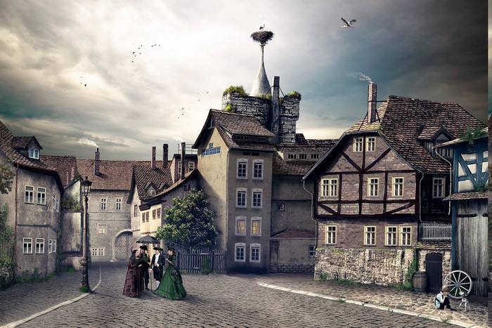 Vintage German cityscape with people and stork nest