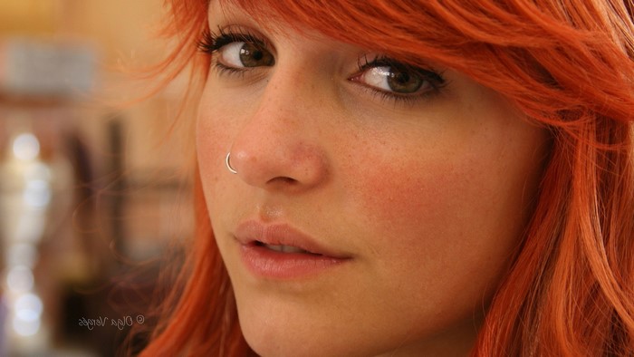 Redhead woman with nose ring close-up