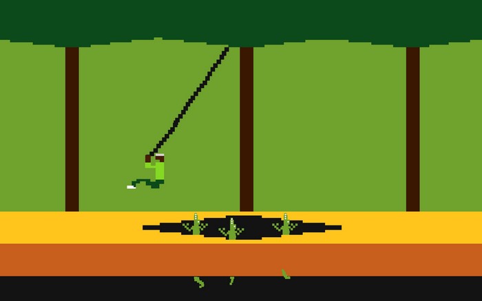 Pitfall Harry swinging across a pit in Pitfall!