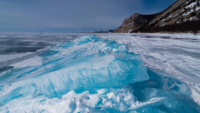 Frozen Lake Baikal with Ice Formations and Mountains