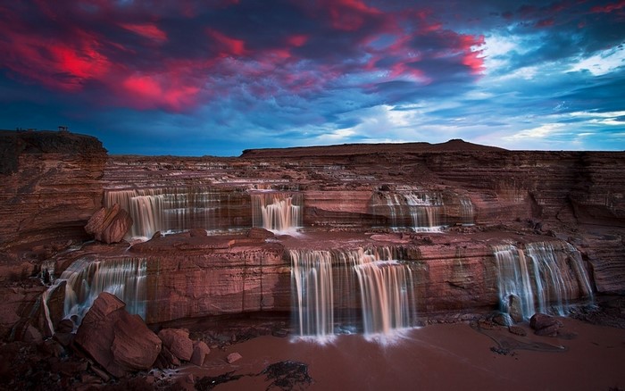 Waterfalls at sunset with red clouds in Arizona