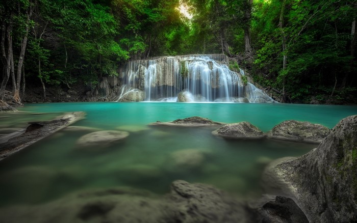 Waterfall in a lush green forest in Thailand