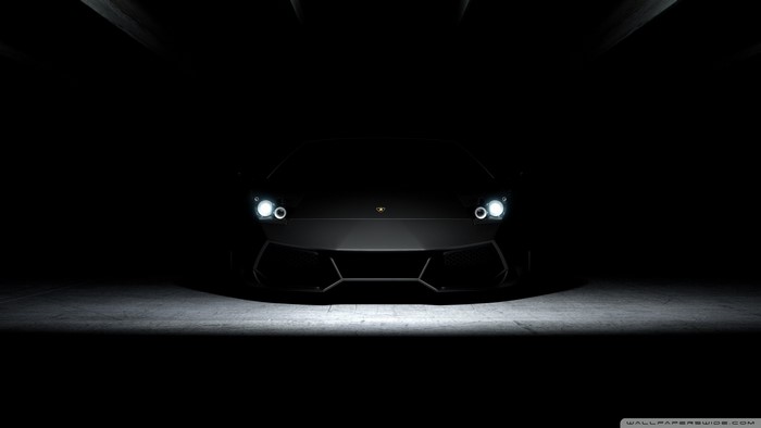 Black Lamborghini Aventador in dark garage