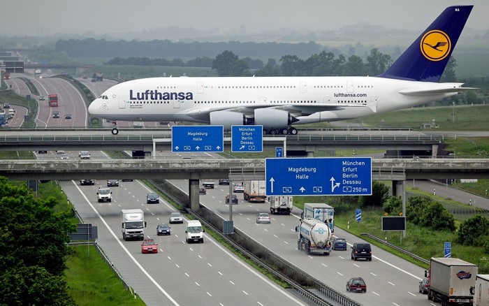 Lufthansa Airbus A380 flying over a highway in Germany