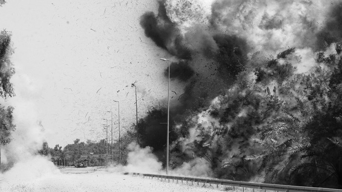 Military explosion with smoke and debris