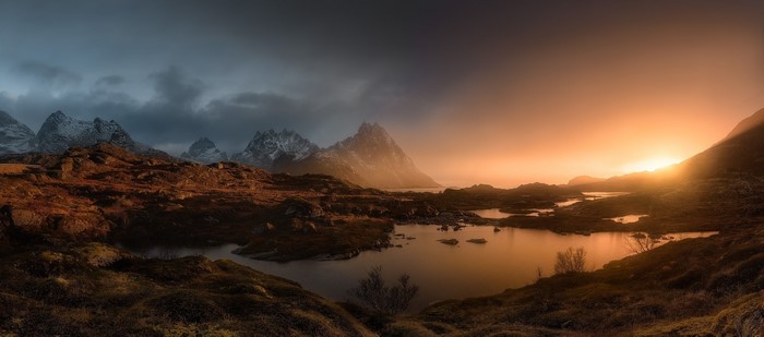 Lofoten Islands Norway sunrise over mountains and pond
