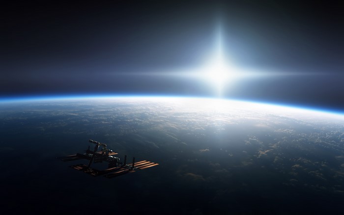 International Space Station orbiting Earth with the Sun