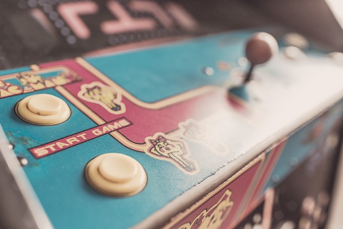 Close-up of an arcade game control panel