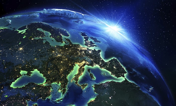 Earth from space with sun rising over Europe