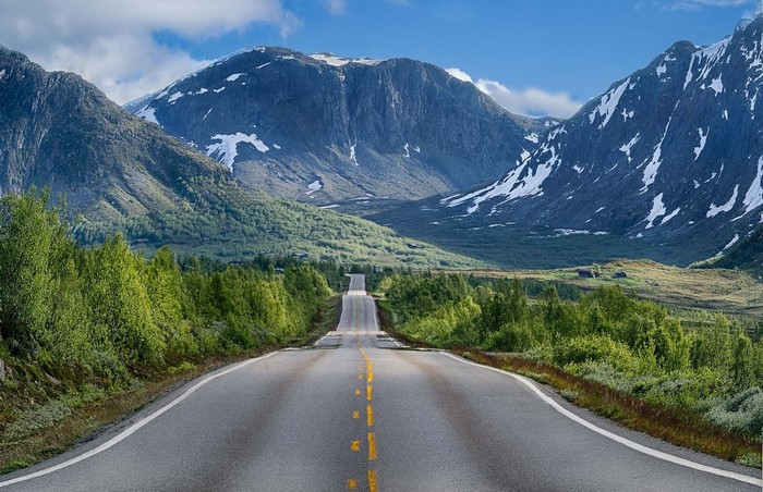Road through a mountain valley in Norway