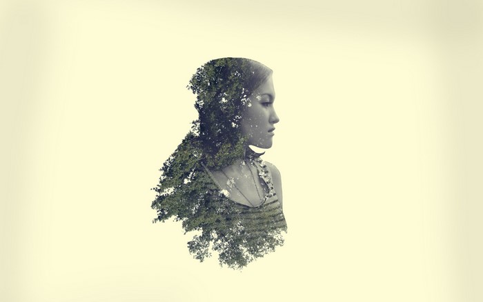 Double exposure of a woman and trees