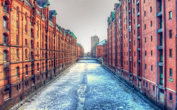 Frozen canal between brick warehouses in Hamburg, Germany