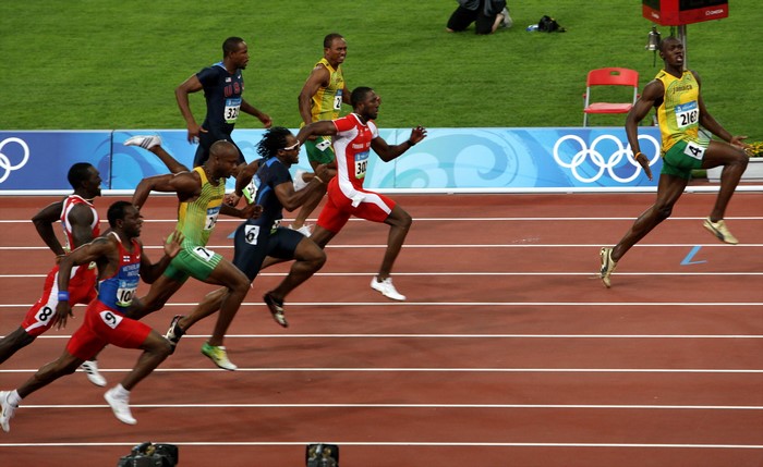 Usain Bolt and other athletes in a sprint race
