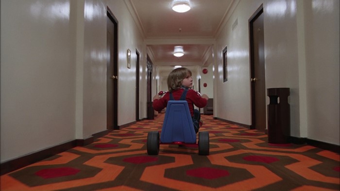 Danny Torrance riding a tricycle in The Shining