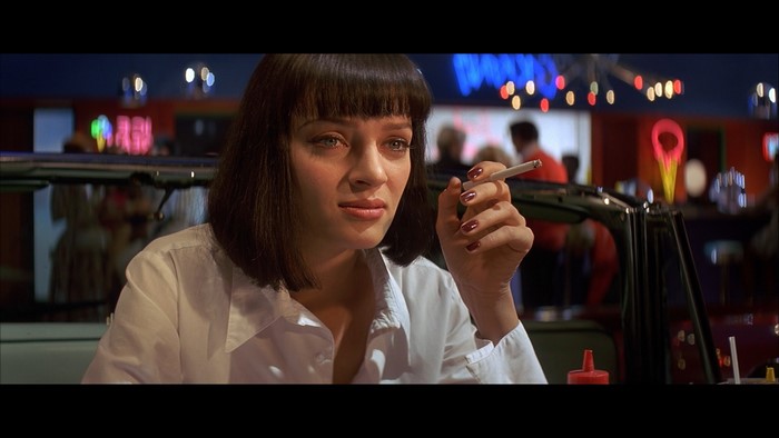 Mia Wallace from Pulp Fiction smoking a cigarette
