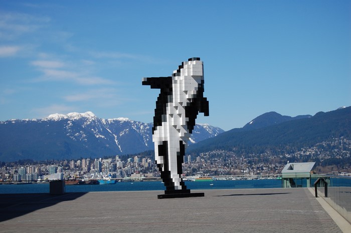 Pixelated Orca Sculpture in Vancouver with Mountains