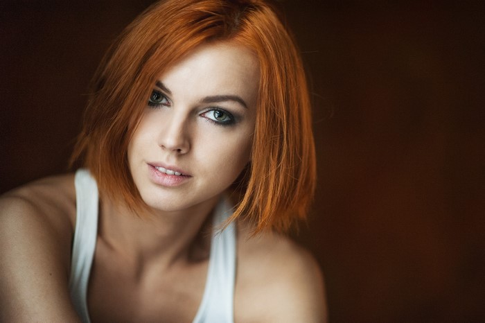 Woman with red hair and green eyes