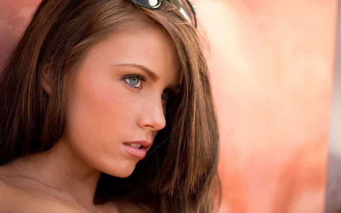 Portrait of a Woman with Long Hair and Blue Eyes