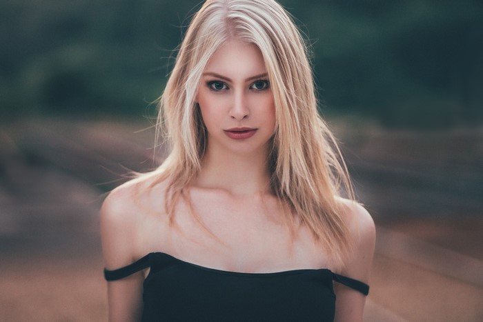 Woman with blonde hair looking at viewer