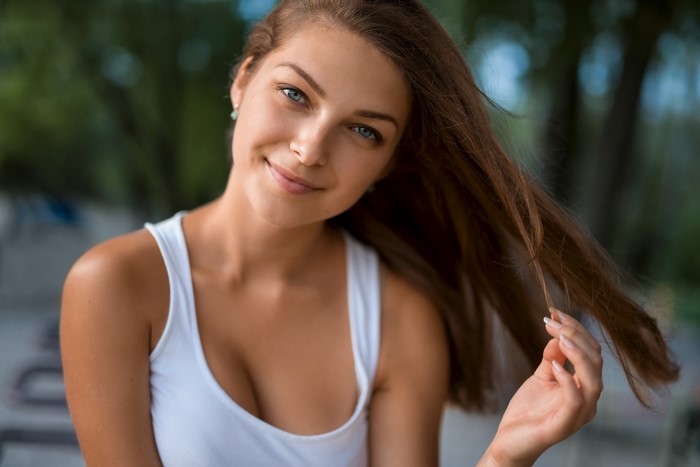 Smiling Woman with Blue Eyes and Flowing Hair