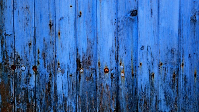 Blue wooden planks with rust and metal