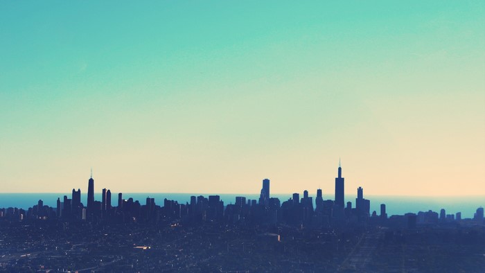 Chicago skyline at dusk with teal and orange sky