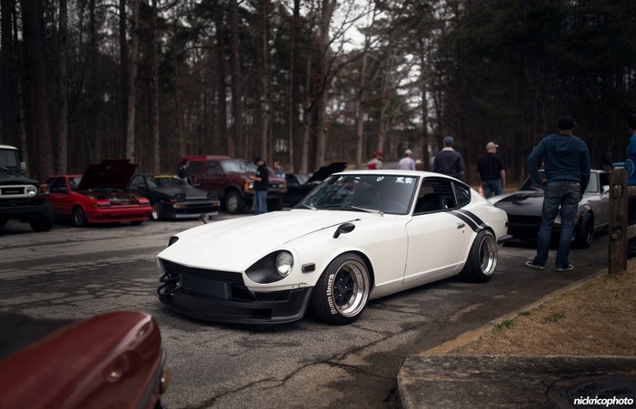 White Datsun 240Z with black stripes at car meet