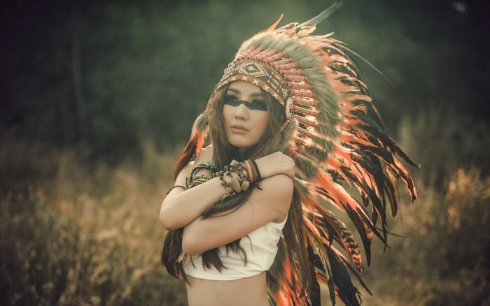 Woman in Native American Headdress with Face Paint
