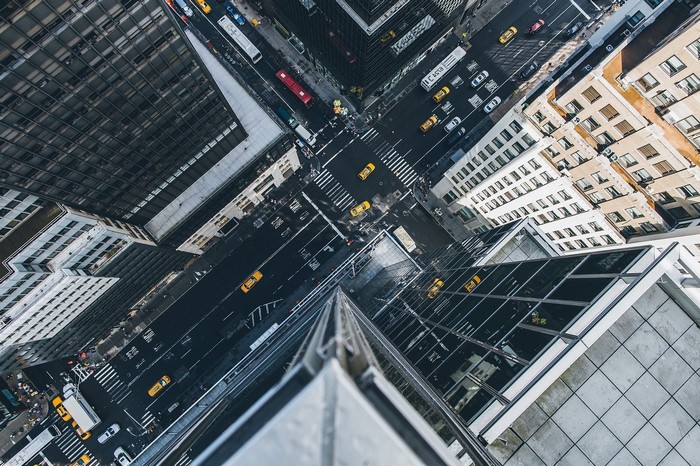 Aerial view of New York City street with taxis and buildings