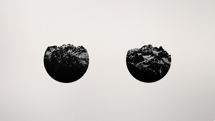Minimalist mountain circles on a plain background