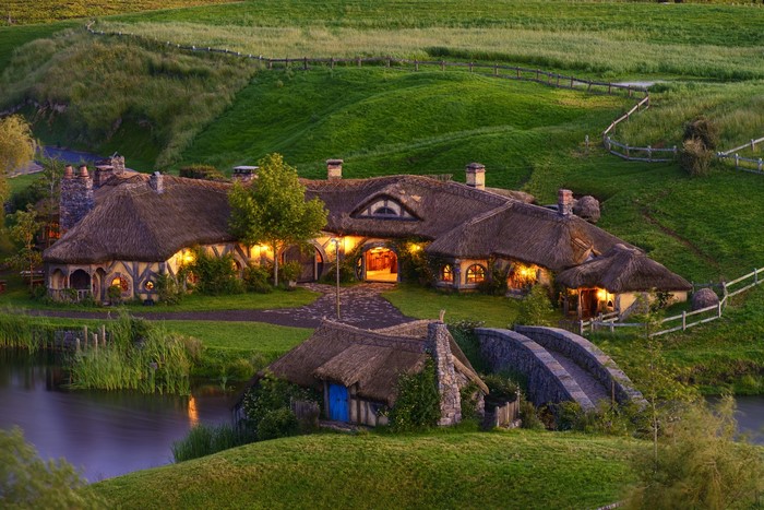 Hobbiton Village at Dusk with Glowing Lights