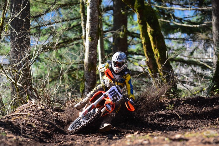Motocross rider on a KTM motorcycle in a forest