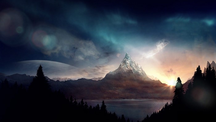 Mountain peak with lake and forest at sunset
