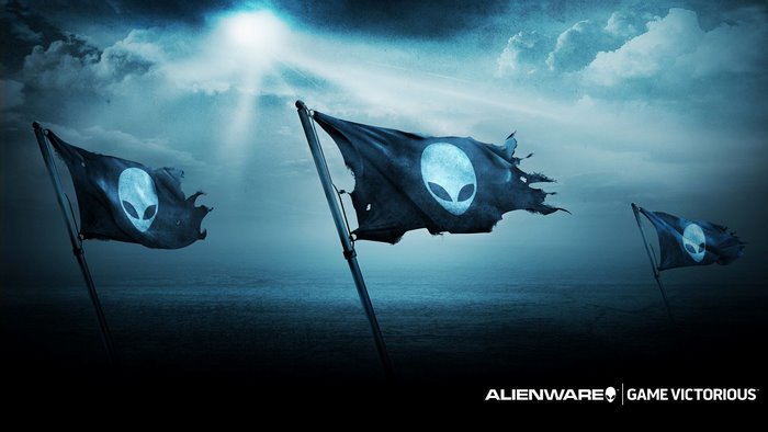 Alienware flags over the ocean under a bright sky