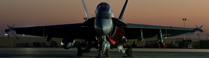McDonnell Douglas F/A-18 Hornet on military base at dusk