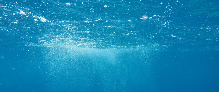 Underwater view with bubbles and light rays